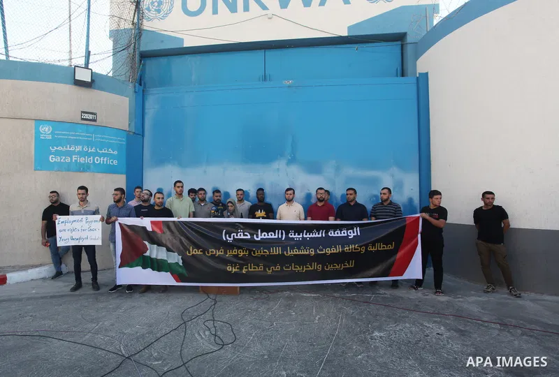 Palestinian graduates take part in a protest to demand job from the United Nations Relief and Works Agency for Palestine Refugees "UNRWA", in front of its headquarters in Gaza City on August 30, 2023. Photo by Omar Ashta...