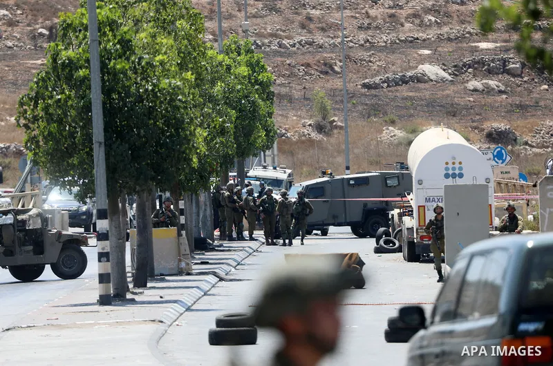 Israeli forces keep guard at the scene of what the Israeli military said is a ramming attack in the West Bank city of Hebron on August 30, 2023. Israeli forces Wednesday shot and injured a Palestinian, south of the West...
