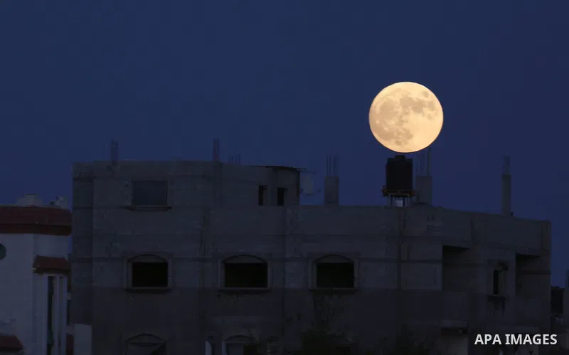 Tonight's blue moon decorates the sky, one of the full moon phenomena that occurs at the end of August, called bloomon, Gaza City, on 30 August 2023. Photo by Omar Al-Dirawi\ apaimages