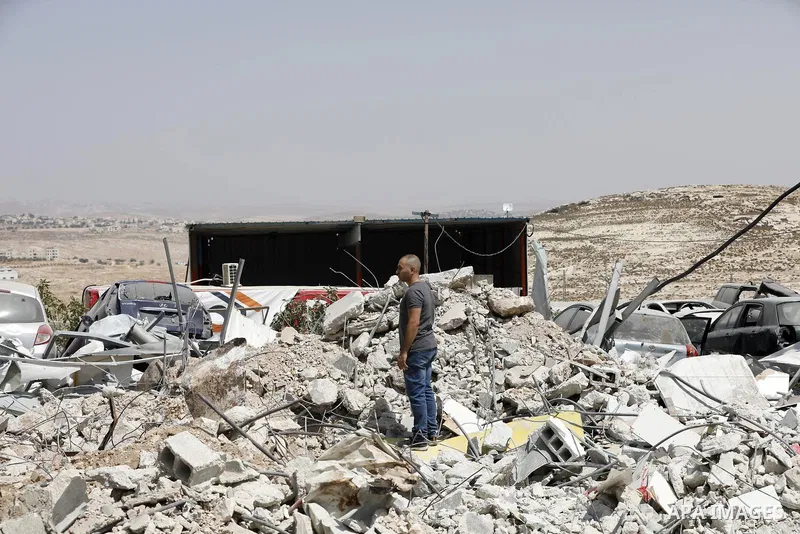 Palestinians inspect the rubble of houses which were demolished by the Israeli army under the pretext of illegal construction in the town of Anata, east of Jerusalem, on September 6, 2023. Israeli bulldozers today demoli...