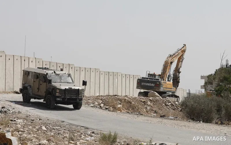 Palestinians inspect the rubble of houses which were demolished by the Israeli army under the pretext of illegal construction in the town of Anata, east of Jerusalem, on September 6, 2023. Israeli bulldozers today demoli...