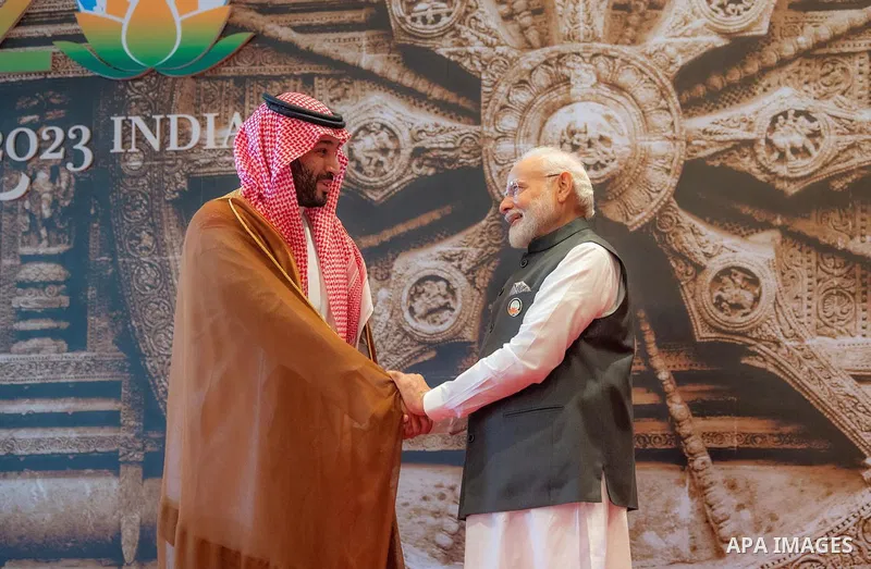 India's Prime Minister Narendra Modi (R) shakes hand with Saudi Arabia's Crown Prince and Prime Minister Mohammed bin Salman ahead of the G20 Leaders' Summit in New Delhi on September 9, 2023. Photo by SPA Saudi Pess Aga...