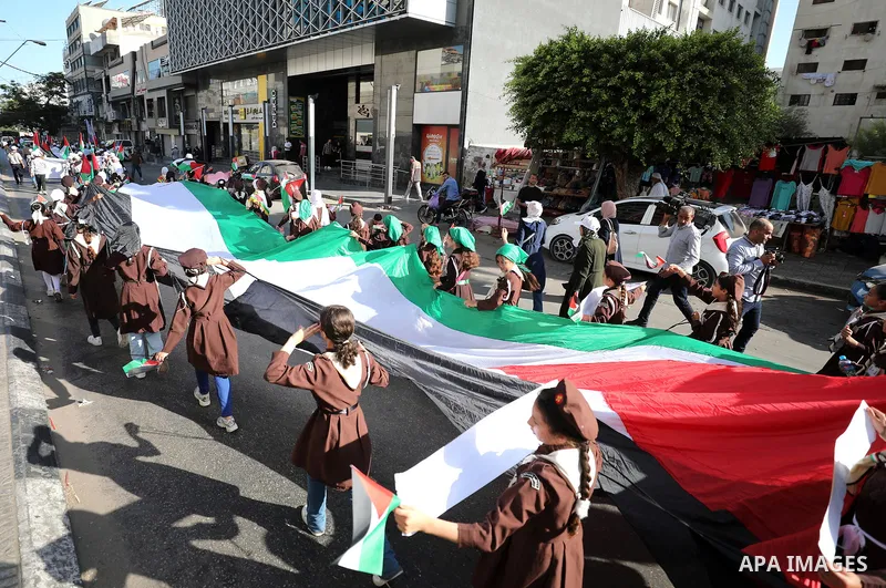 Palestinian children participate in a scouting march marking the anniversary of Israeli disengagement from Gaza, in Gaza city, on September 11, 2023. The Israeli disengagement from Gaza was the unilateral dismantling in...