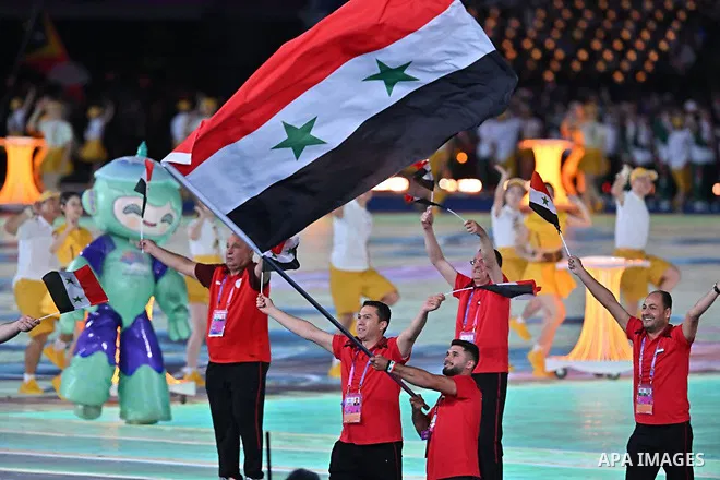 Syria's President Bashar al-Assad and First Lady Asma al-Assad attend the opening of the Asian Games in its nineteenth edition in China on September 23, 2023. Photo by Syrian Presidency\ apaimages