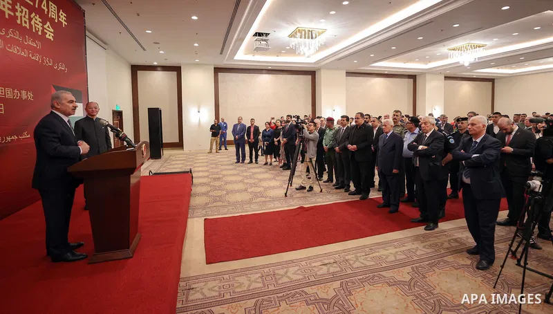Palestinian Prime Minister Mohammad Shtayyeh delivers a speech on the 74th anniversary of the founding of the People's Republic of China at a celebration held by the Chinese Embassy, in Ramallah, West Bank , on September...