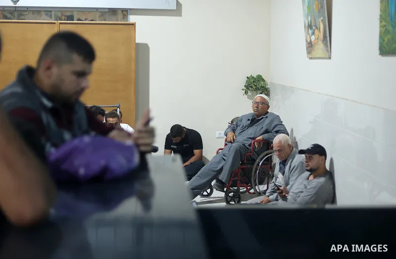 Palestinian workers wait at the Erez crossing as they prepare to leave Beit Hanun in the northern Gaza Strip, to go to work inside Israel, on September 28, 2023. Erez Crossing opened after closing it two weeks ago in res...