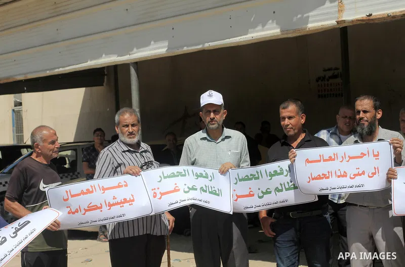 Palestinians take part in a protest against the Israeli siege on the Gaza Strip, in front of the Erez Crossing in Beit Hanoun in the northern Gaza Strip on September 28, 2023. The Gaza Strip, where more than two million...