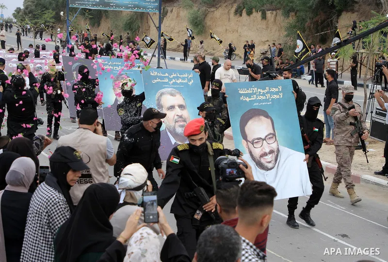 Fighters of the Al-Quds Brigades, the military wing of the Islamic Jihad movement in Palestine, participate in a military parade on the occasion of the movement’s 36th launch, in the central Gaza Strip on October 4, 2023...