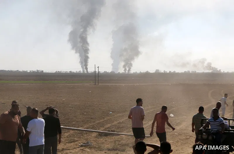 People run as the clashes between Palestinian groups and Israeli forces continue in Gaza City, Gaza on October 7, 2023. Photo by STR\ apaimages