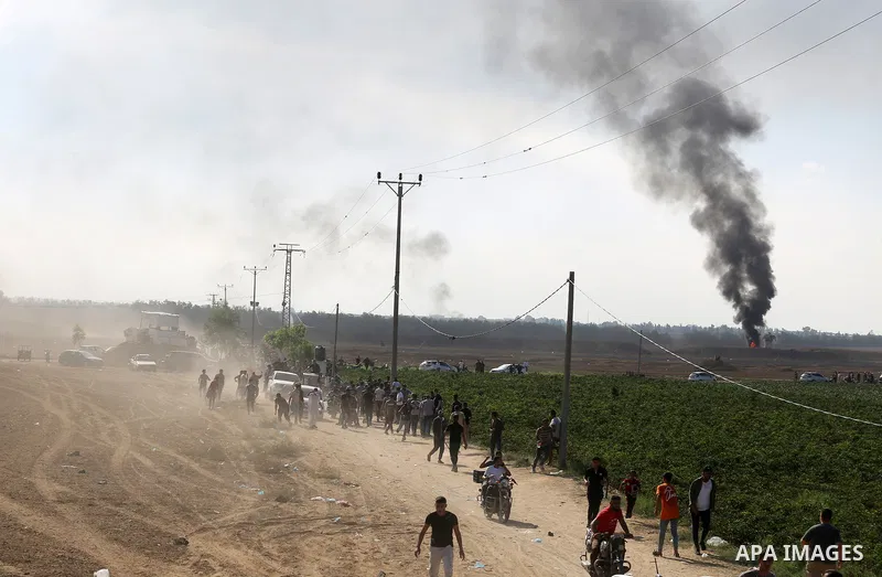 People run as the clashes between Palestinian groups and Israeli forces continue in Gaza City, Gaza on October 7, 2023. Photo by STR\ apaimages