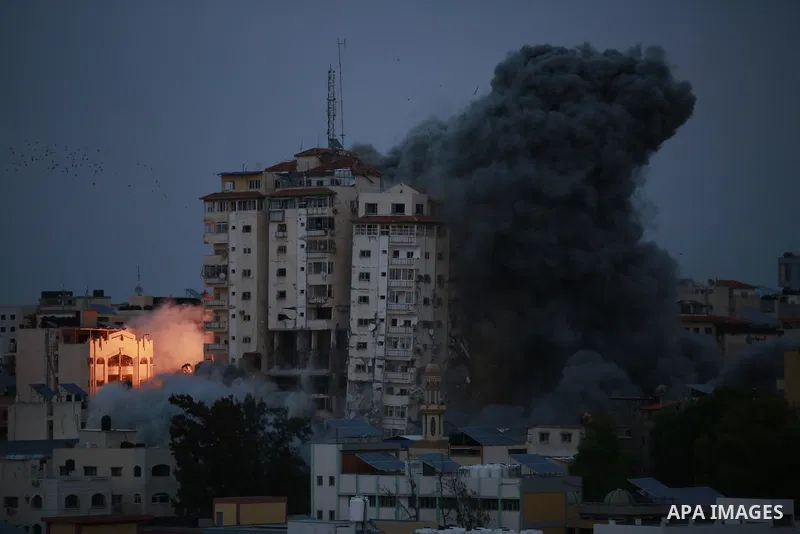 Smoke and flames billow after Israeli forces struck a high-rise tower in Gaza City, October 7, 2023. Palestinian militants have begun a "war" against Israel which they infiltrated by air, sea and land from the blockaded...