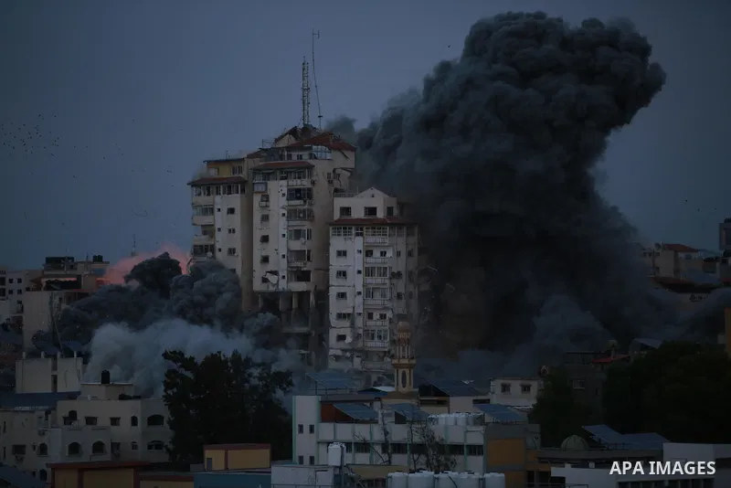 Smoke and flames billow after Israeli forces struck a high-rise tower in Gaza City, October 7, 2023. Palestinian militants have begun a "war" against Israel which they infiltrated by air, sea and land from the blockaded...