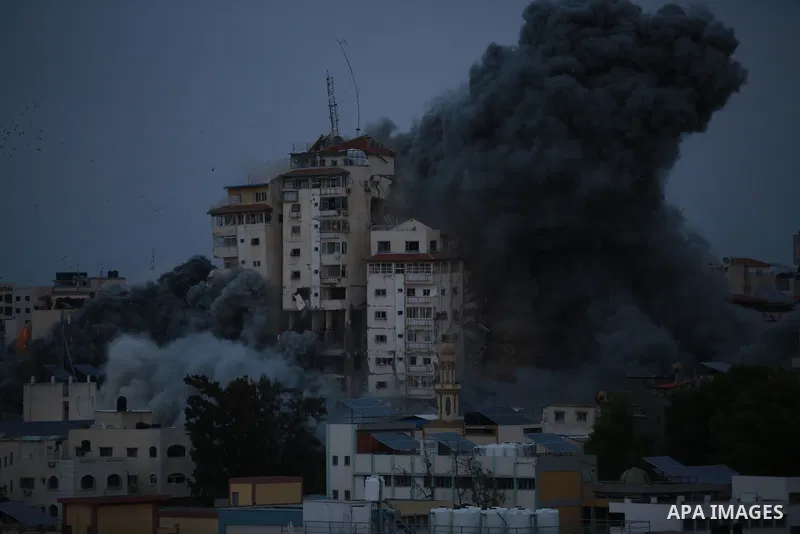Smoke and flames billow after Israeli forces struck a high-rise tower in Gaza City, October 7, 2023. Palestinian militants have begun a "war" against Israel which they infiltrated by air, sea and land from the blockaded...