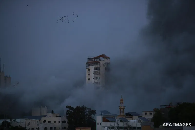 Smoke and flames billow after Israeli forces struck a high-rise tower in Gaza City, October 7, 2023. Palestinian militants have begun a "war" against Israel which they infiltrated by air, sea and land from the blockaded...
