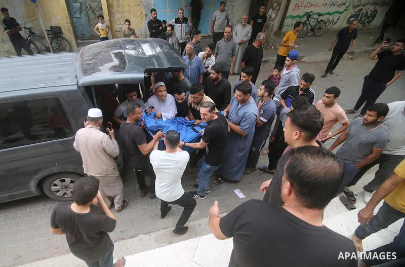 Palestinians carry the bodies of the Zanoun family during their funeral in Rafah in the southern Gaza Strip on October 9, 2023. A total of 572 Palestinians have been killed as by Israeli occupation forces and settlers si...