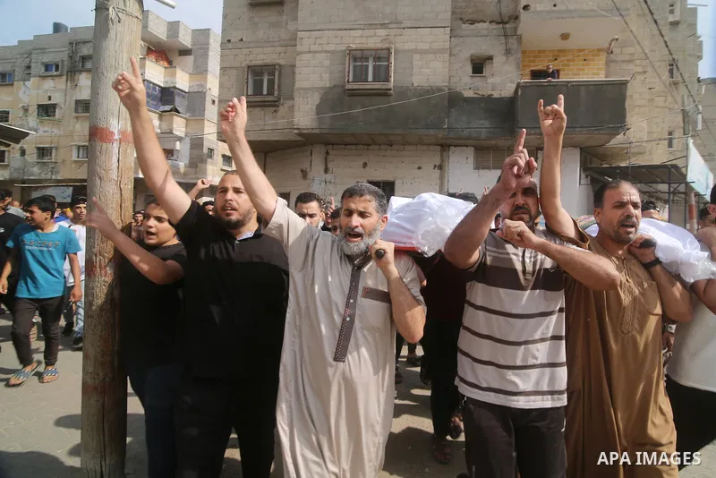 Palestinians carry the bodies of the Zanoun family during their funeral in Rafah in the southern Gaza Strip on October 9, 2023. A total of 572 Palestinians have been killed as by Israeli occupation forces and settlers si...