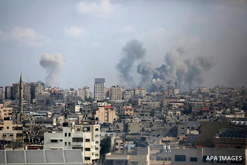 Smoke rises over the buildings after Israeli airstrikes in Gaza City, Gaza on October 10. Photo by Bashar Taleb\ apaimages