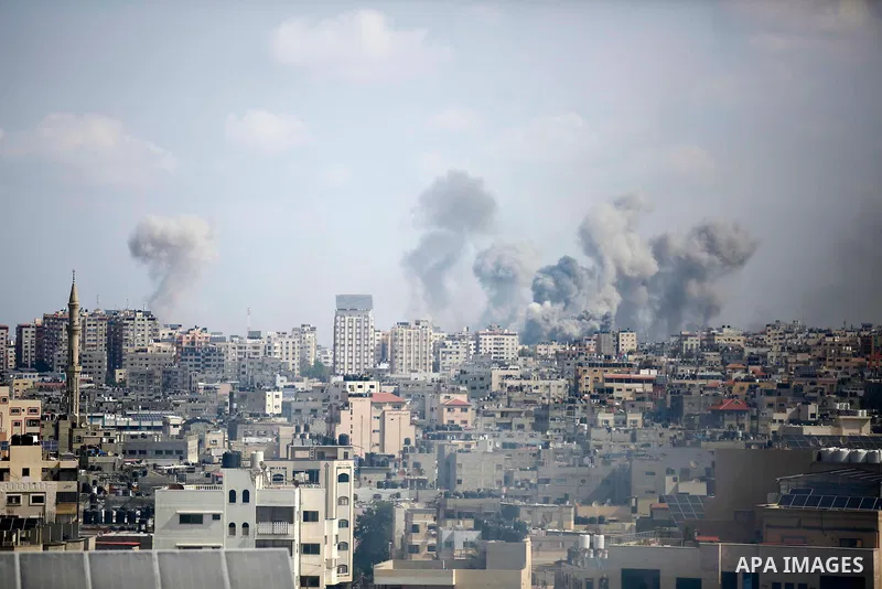 Smoke rises over the buildings after Israeli airstrikes in Gaza City, Gaza on October 10. Photo by Bashar Taleb\ apaimages