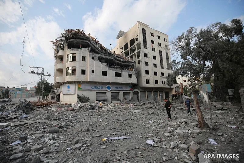 Palestinians inspect the damage following an Israeli airstrike on the El-Remal aera in Gaza City on October 9, 2023. Israel continued to battle Hamas fighters on October 10 and massed tens of thousands of troops and heav...