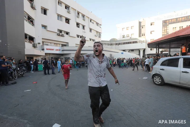 Medics transport wounded children into at al-Shifa hospital following Israeli strikes in Gaza City on October 10, 2023. Israel said it recaptured Gaza border areas from Hamas as the war's death toll passed 3,000 on Octob...