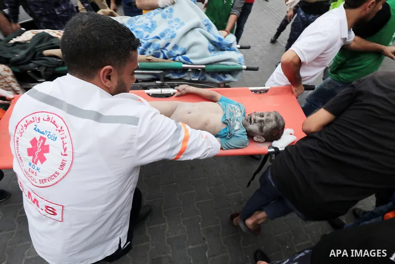 Medics transport wounded children into at al-Shifa hospital following Israeli strikes in Gaza City on October 09, 2023. Israel said it recaptured Gaza border areas from Hamas as the war's death toll passed 3,000 on Octob...