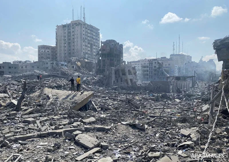 Palestinians inspect the damage following an Israeli airstrike on the El-Remal aera in Gaza City on October 9, 2023. Israel continued to battle Hamas fighters on October 10 and massed tens of thousands of troops and heav...