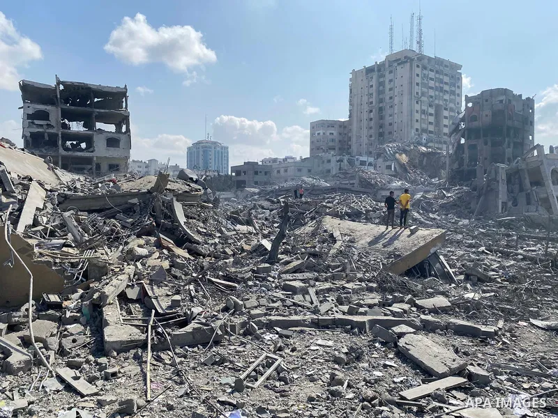 Palestinians inspect the damage following an Israeli airstrike on the El-Remal aera in Gaza City on October 9, 2023. Israel continued to battle Hamas fighters on October 10 and massed tens of thousands of troops and heav...