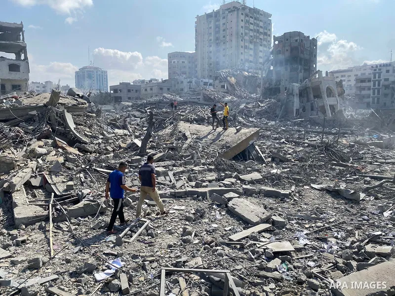 Palestinians inspect the damage following an Israeli airstrike on the El-Remal aera in Gaza City on October 9, 2023. Israel continued to battle Hamas fighters on October 10 and massed tens of thousands of troops and heav...