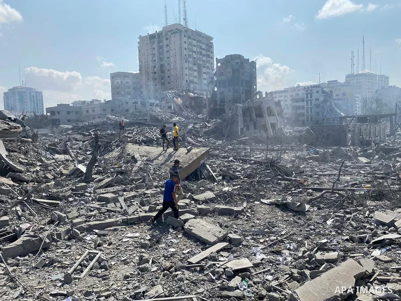 Palestinians inspect the damage following an Israeli airstrike on the El-Remal aera in Gaza City on October 9, 2023. Israel continued to battle Hamas fighters on October 10 and massed tens of thousands of troops and heav...
