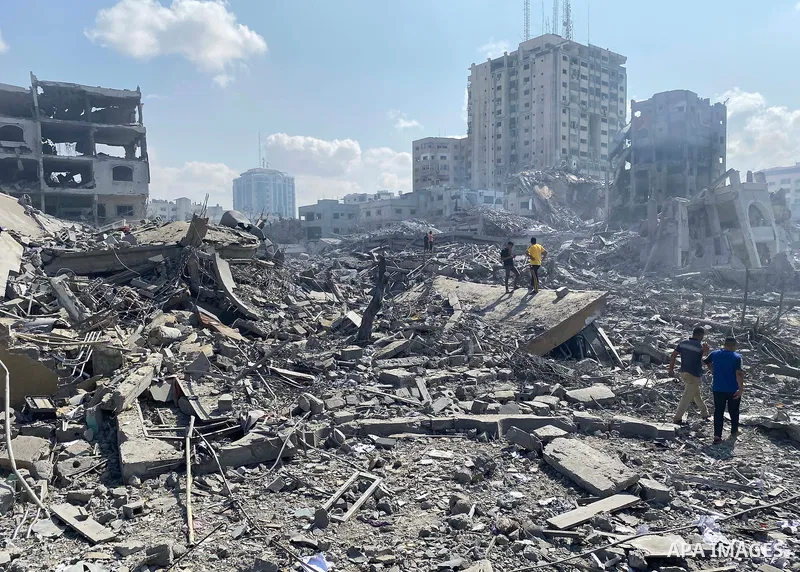 Palestinians inspect the damage following an Israeli airstrike on the El-Remal aera in Gaza City on October 9, 2023. Israel continued to battle Hamas fighters on October 10 and massed tens of thousands of troops and heav...