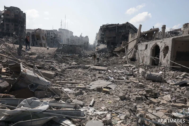 Palestinians inspect the damage following an Israeli airstrike on the El-Remal aera in Gaza City on October 9, 2023. Israel continued to battle Hamas fighters on October 10 and massed tens of thousands of troops and heav...