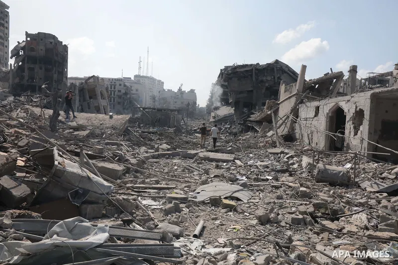 Palestinians inspect the damage following an Israeli airstrike on the El-Remal aera in Gaza City on October 9, 2023. Israel continued to battle Hamas fighters on October 10 and massed tens of thousands of troops and heav...