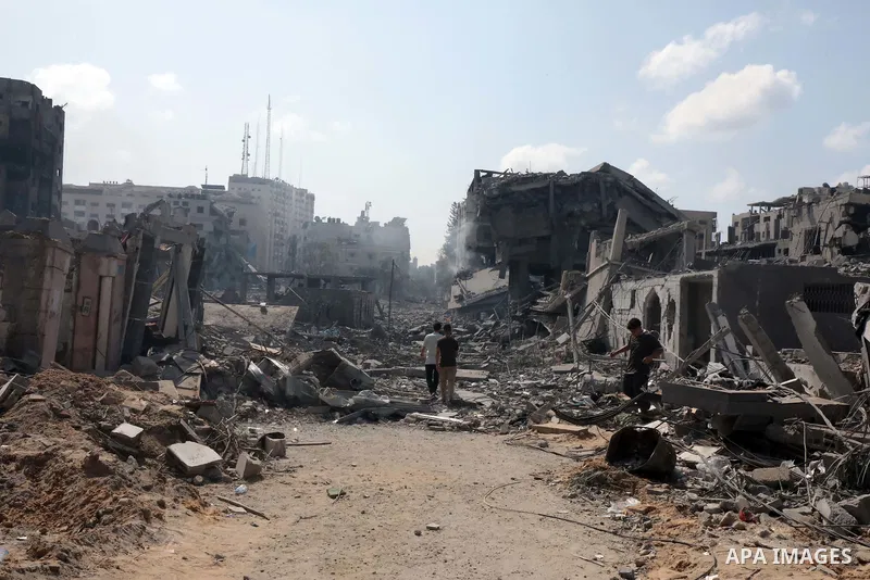 Palestinians inspect the damage following an Israeli airstrike on the El-Remal aera in Gaza City on October 9, 2023. Israel continued to battle Hamas fighters on October 10 and massed tens of thousands of troops and heav...