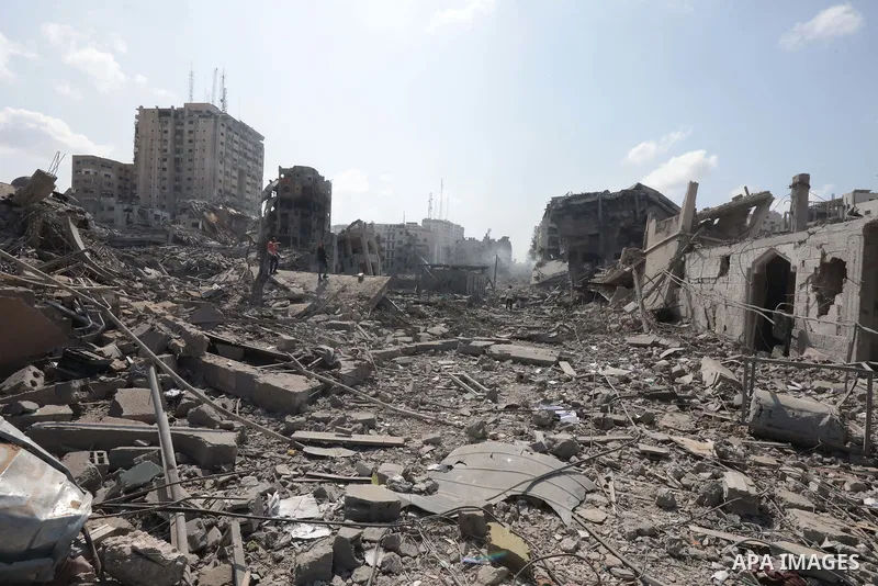 Palestinians inspect the damage following an Israeli airstrike on the El-Remal aera in Gaza City on October 9, 2023. Israel continued to battle Hamas fighters on October 10 and massed tens of thousands of troops and heav...