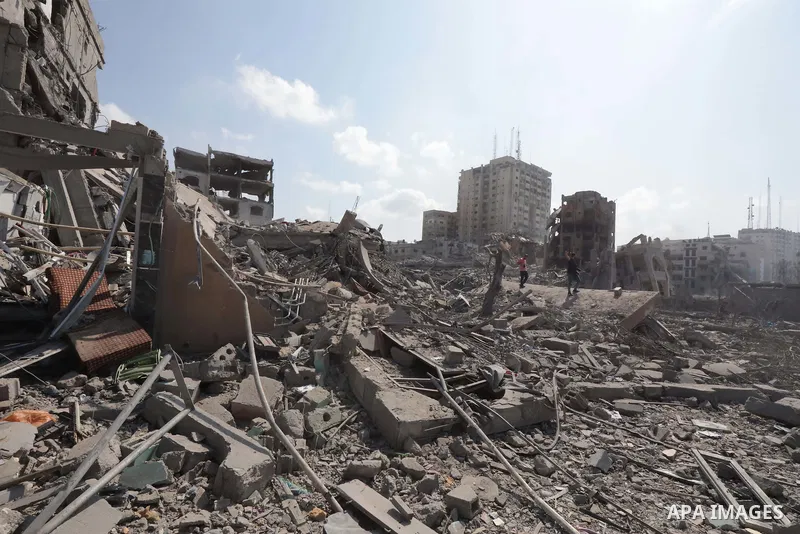 Palestinians inspect the damage following an Israeli airstrike on the El-Remal aera in Gaza City on October 9, 2023. Israel continued to battle Hamas fighters on October 10 and massed tens of thousands of troops and heav...