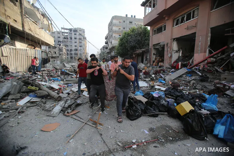 Palestinian families evacuates to safer areas following overnight Israeli shelling in Gaza city on October 11, 2023. Israel pounded Hamas targets in Gaza on October 11and said the bodies of 1,500 Islamist militants were...