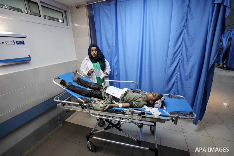 Wounded Palestinians wait for treatment at the overcrowded emergency ward of Al-Shifa hospital in Gaza City following an Israeli airstrike on October 11, 2023, as raging battles between Israel and the Hamas movement cont...