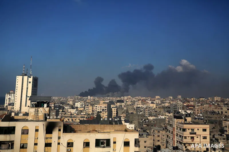 Smoke billows during Israeli air strikes in Gaza City on October 12, 2023 as raging battles between Israel and the Hamas movement continue for the sixth consecutive day. Thousands of people, both Israeli and Palestinians...