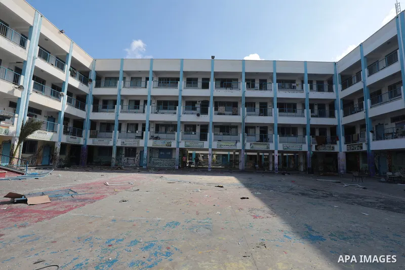 Palestinians inspect a destroyed of a school for Palestinian refugees after an airstrike that killed 8 people, in the Maghazi camp in the central Gaza Strip, on 18 October 2023. Photo by Naaman Omar\ apaimages Palestinia...