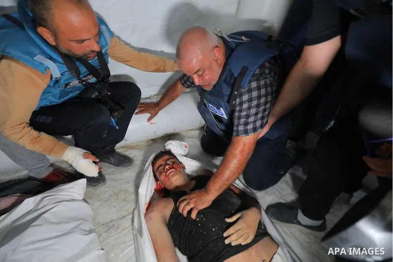 Al Jazeera Qatari correspondent, Wael Al-Dahdouh, cries for some of his children and relatives, who were killed in an Israeli air strike on a building in Nuseirat, in the central Gaza Strip, on October 25, 2023. Photo by...