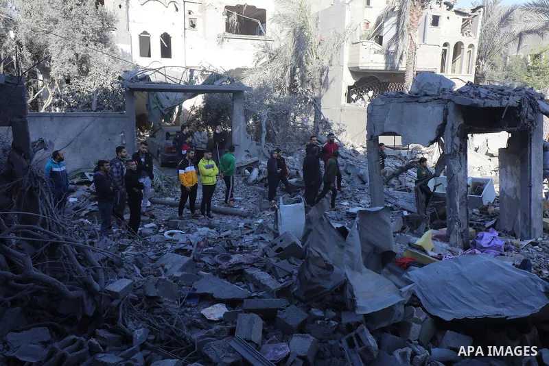 Palestinian residents conduct a search and rescue operation among the destroyed buildings after Israeli attacks in Al-Maghazi, Gaza on December 11, 2023. Photo by Naaman Omar\ apaimages