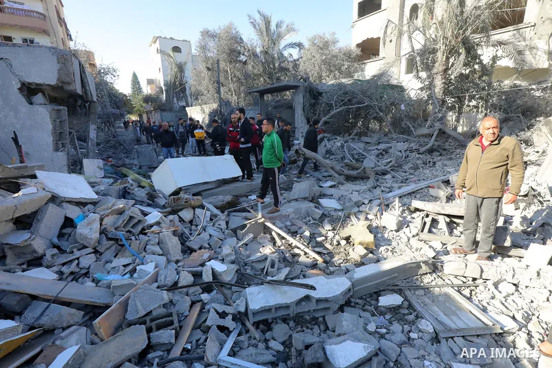 Palestinian residents conduct a search and rescue operation among the destroyed buildings after Israeli attacks in Al-Maghazi, Gaza on December 11, 2023. Photo by Naaman Omar\ apaimages