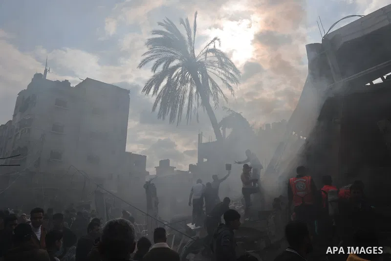 Rescuers and civilians look for survivors amid the rubble of destroyed buildings following Israeli bombardment in Rafah, in the southern Gaza Strip on December 14, 2023, Thousands of Palestinians civilian, have died sinc...