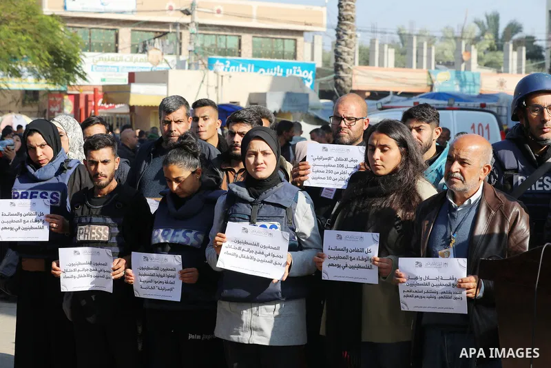 Palestinian journalists participate in a solidarity stand on the Day of Loyalty to the Palestinian Journalist at Al-Aqsa Martyrs Hospital, Deir Al-Balah in the central Gaza Strip, on December 31, 2023. Photo by Ali Hamad...