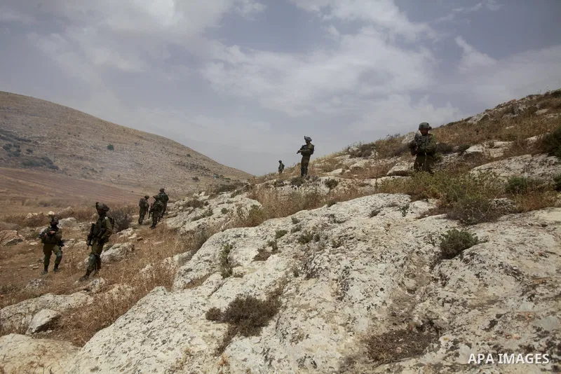 Israeli security forces take position during a protest by Palestinians against the establishment of Israeli outposts, in Beit Dajan, east of the West Bank city of Nablus, on June 2, 2023. Photo by Mohammed Nasser\ apaima...