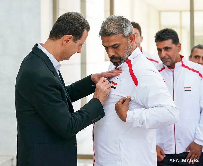 Syrian President Bashar Al-Assad meets with the players of the al-Futowa team, which won the Syrian local league championship, in Damascus, on June 7, 2023. Photo by Syrian Presidency\ apaimages