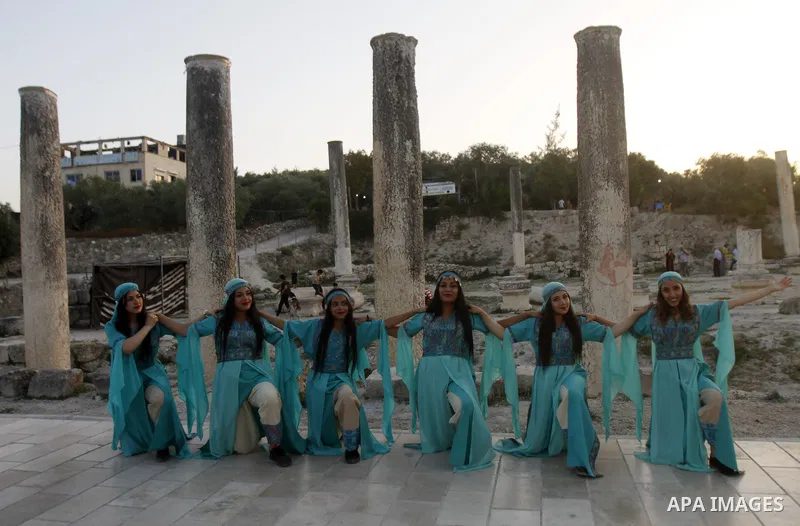 Palestinians attend the "Here We Stay" festival against settlement in the village of Sebastia near the West Bank city of Nablus on June 10, 2023. The ancient town of Sebastia is one of the greatest archaeological sites o...