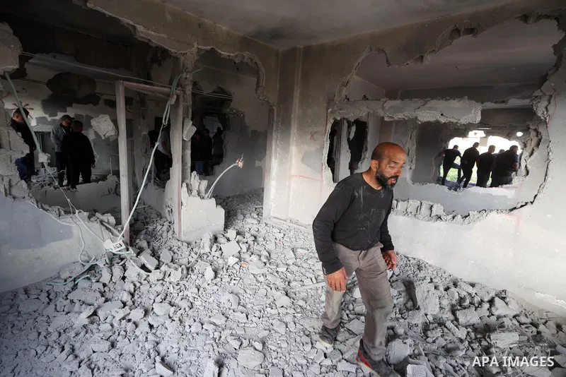 People inspect home of Palestinian youth Mutaz Khawaja demolished by Israeli forces in the village of Ni'lin, west of the West Bank city of Ramallah, on May 23, 2023. In a punitive measure, Israeli forces today blew up t...