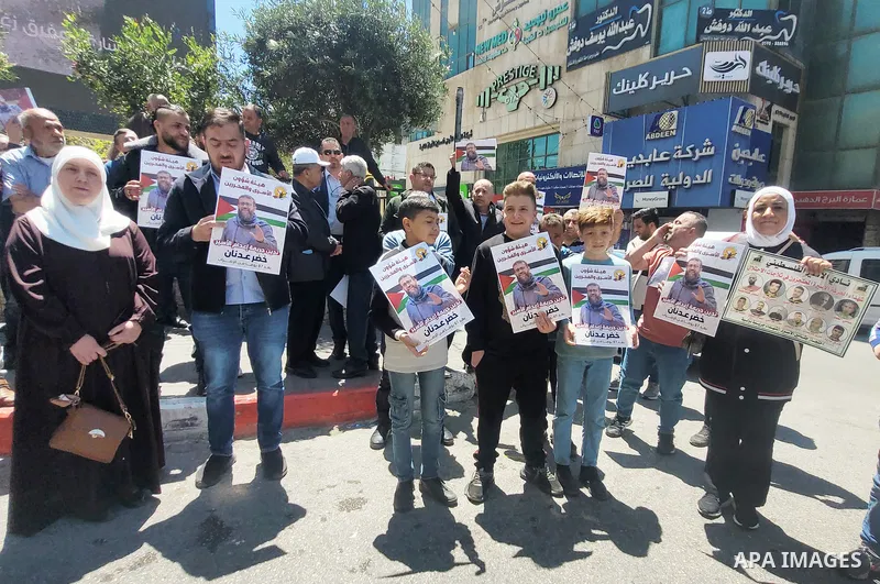 Palestinians take part in a protest following the announcement of the death of a Palestinian hunger striker Khader Adnan who was in Israeli Jails in the West Bank city of Hebron on May 2, 2023. Israel's prison service an...