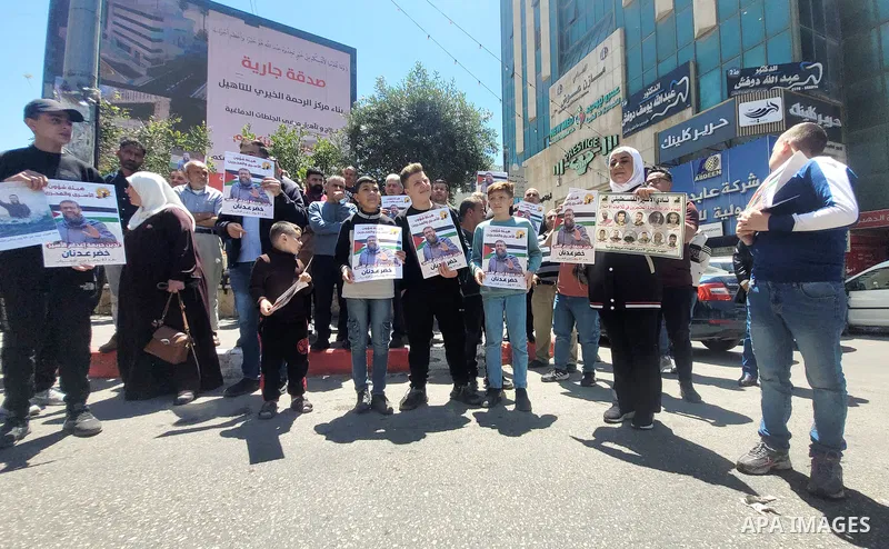 Palestinians take part in a protest following the announcement of the death of a Palestinian hunger striker Khader Adnan who was in Israeli Jails in the West Bank city of Hebron on May 2, 2023. Israel's prison service an...